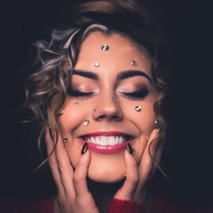 Aisha Malik, Lead Design Curator at Pebble Pilot Frame, reviewing corporate floral arrangements